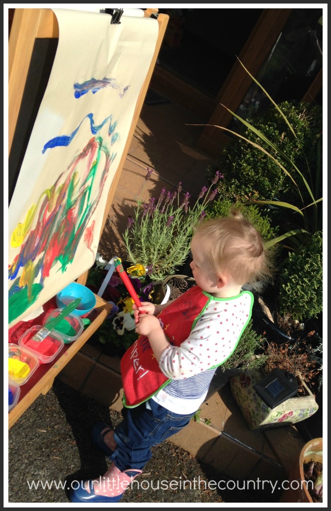 While D was at preschool the other morning O requested to take her easel outside so that she could "paint in the sunshine!"