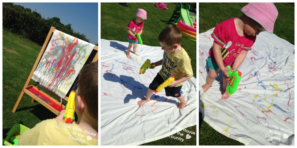 Painting with Water Pistols - More Messy Outdoor Summer Art Fun! - Our Little House in the Country #waterguns #waterpistols #summer #kidsactivities #artforkids
